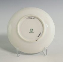 Hand-Decorated Cup and Saucer Featuring a Stylized Border and Roses