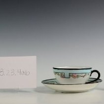 Hand-Decorated Cup and Saucer Featuring a Stylized Border and Roses