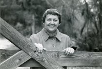 Eugenia Price Standing at Gate to The Dodge