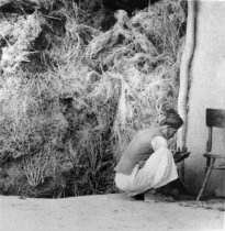 Man in Front of Wall of Vegetation, Andkhoy, Afghanistan