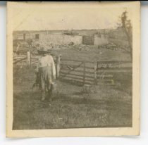 W.G. Maffett & the wall [fence] of his farm which was burned by lightning Aug. 7 1918