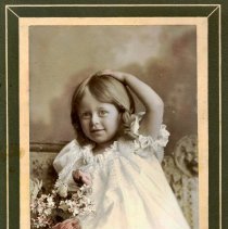 Young Vera (Moore) Paul with roses