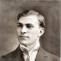 Leonard Paul portrait with high collar