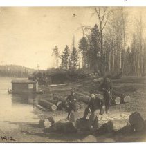 Logs at water's edge 1912