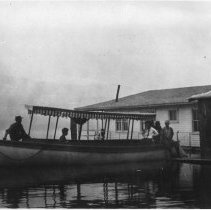 The Firefly at dock with people