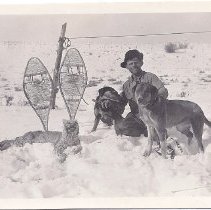 man with hunted bobcat