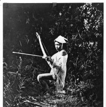 Paiute man with bow and arrow
