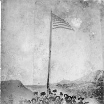 Raising the flag on Grutt Hill, Rawhide, Nev., 1908