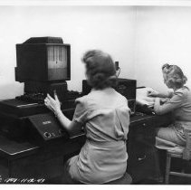 Two Women Seated in Laboratory, Pr.1808  -  BMI Series