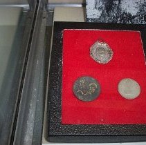 broach, button, and coin
