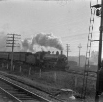 Steam lokie pulling passenger train