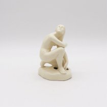 Kneeling nude