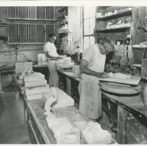 Cowan employees removing pieces from molds