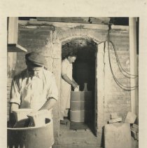 Cowan employees loading kiln