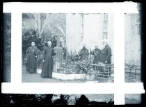 Priests and brothers at the grave of Father Damien De Veuster, SS.CC., Kalawao, Molokai, 1913.