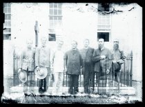 Joseph Dutton with Franciscan and Sacred Hearts religious visiting the grave of Father Damien De Veuster, SS.CC., Kalawao, Molokai.