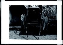 Two men and a horse carriage, Molokai.