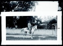John D. McVeigh on horse in front of his home, Kalaupapa, Molokai,