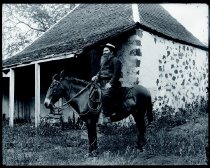 Father Victor Poirier, SS.CC. on horseback.