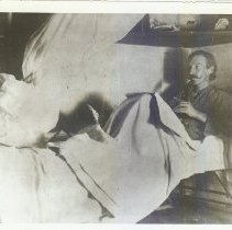 RLS playing his flageolet in bed, Hawaii