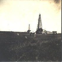 Men with oil derricks