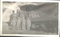 Soldiers by train engine