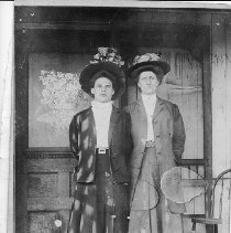 Women standing in fron of store