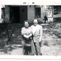 Reverand and Mrs. Wells infront of First Baptist Church