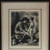 Mother washing child