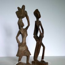 African Woman Walking with Basket on Head