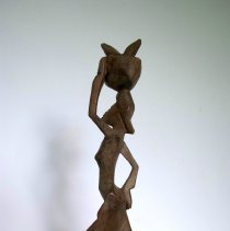 African Woman Walking with Basket on Head