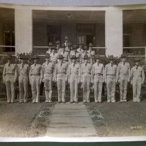 2nd Lt. William Reed in Formation with other officers in hats (rear row, right)