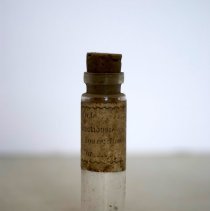Vial (with cork and directions label)