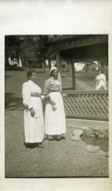 Domestic Servants Standing Near a Gazebo
