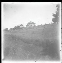 House and barn on hillside