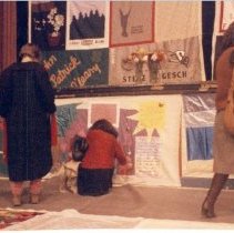 People view the quilts