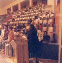 Person speaks to group at memorial