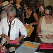 Attendees make donations.