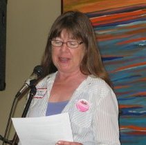 Kater Pollock reads speech at ceremony.