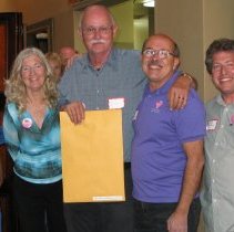 Bob Correa and Denny Carroll accept lifetime achievement awards.