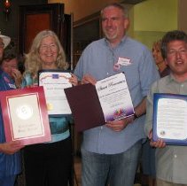 Stuart Rosenstein poses with certificates for his appreciation.