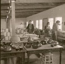 Individuals at the pottery studio.