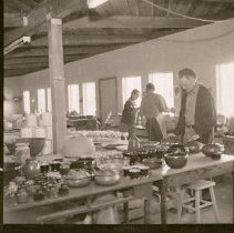 Individuals at the pottery studio.