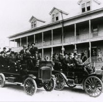 Men in cars outside of Oceanview Hotel.