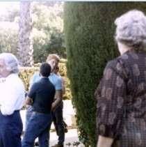 Candid of  a man and other people in public.