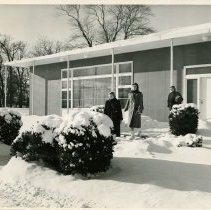 Three Women Leaving a House