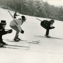 Three Unknown Student Skiers
