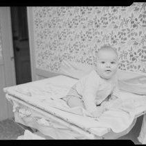 Baby, Jim Gallagher, on a changing table