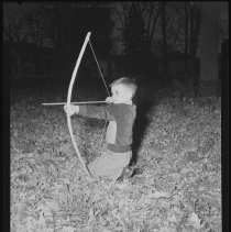 Boy with bow and arrow