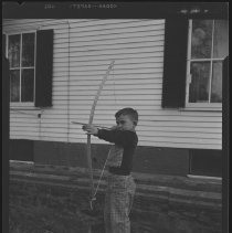 Boy with bow and arrow